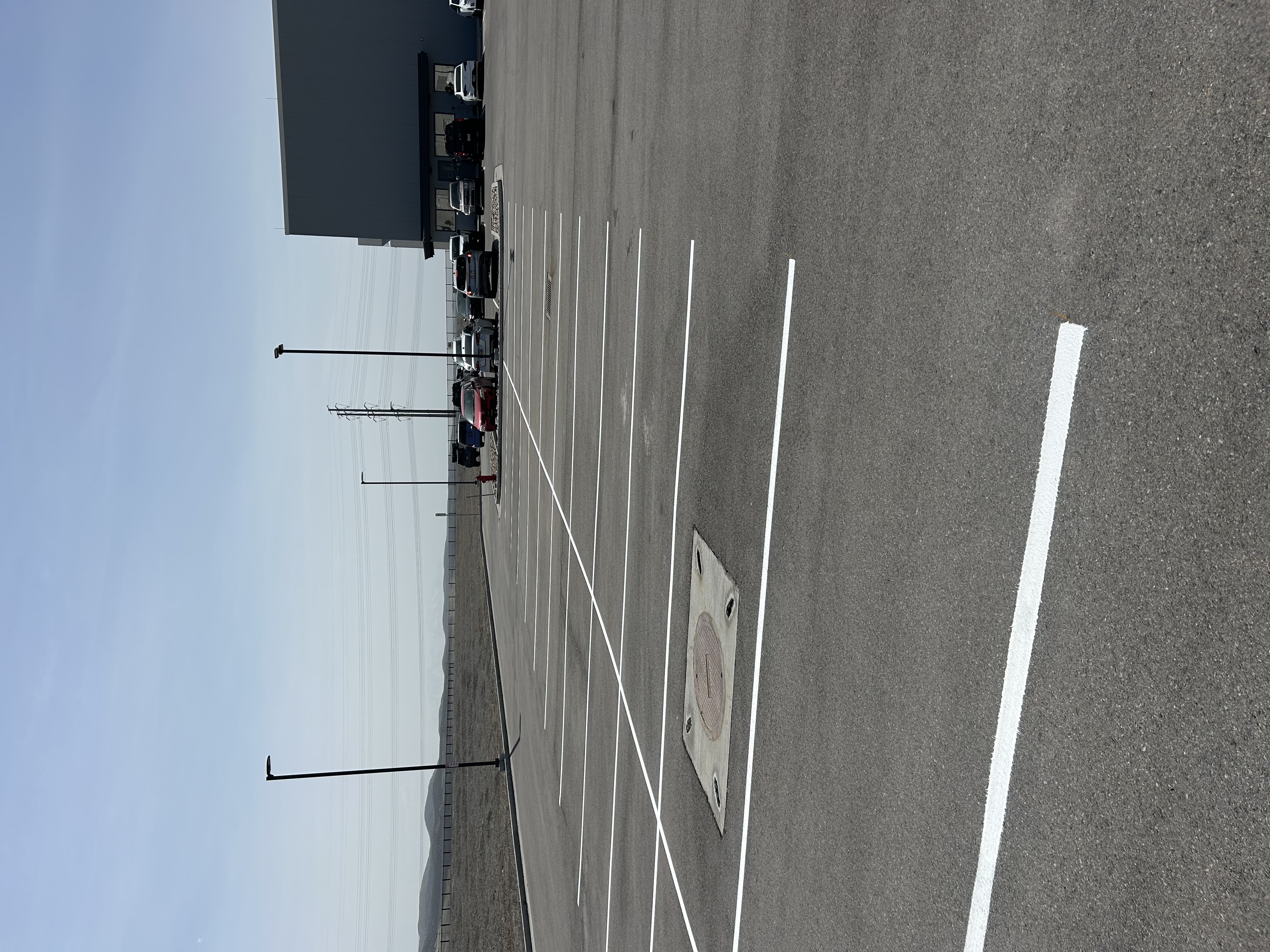 Freshly striped parking stalls in a large lot