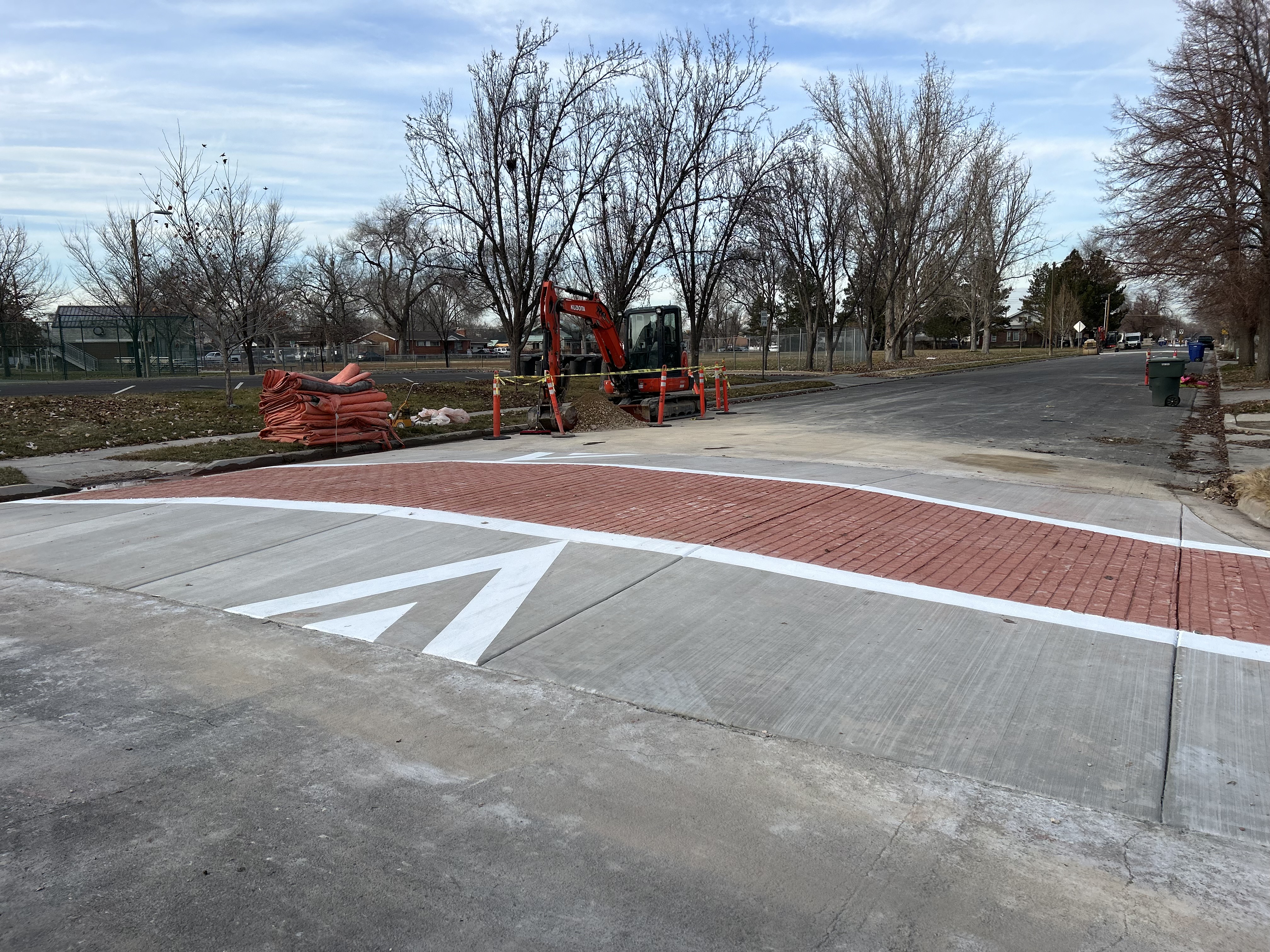 Decorative brick-style crossing marking with directional arrow