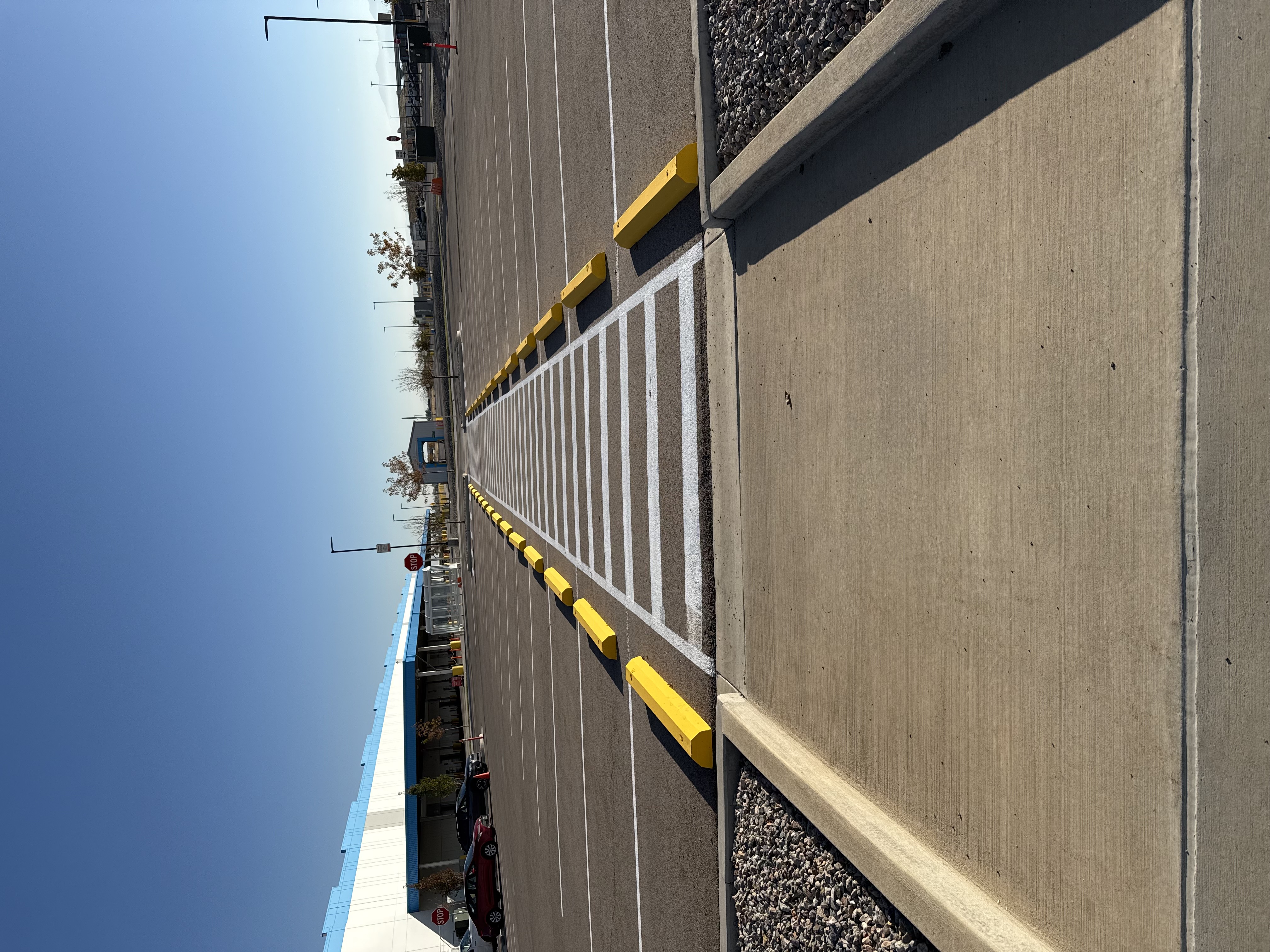 Crosswalk and curb marking near parking area